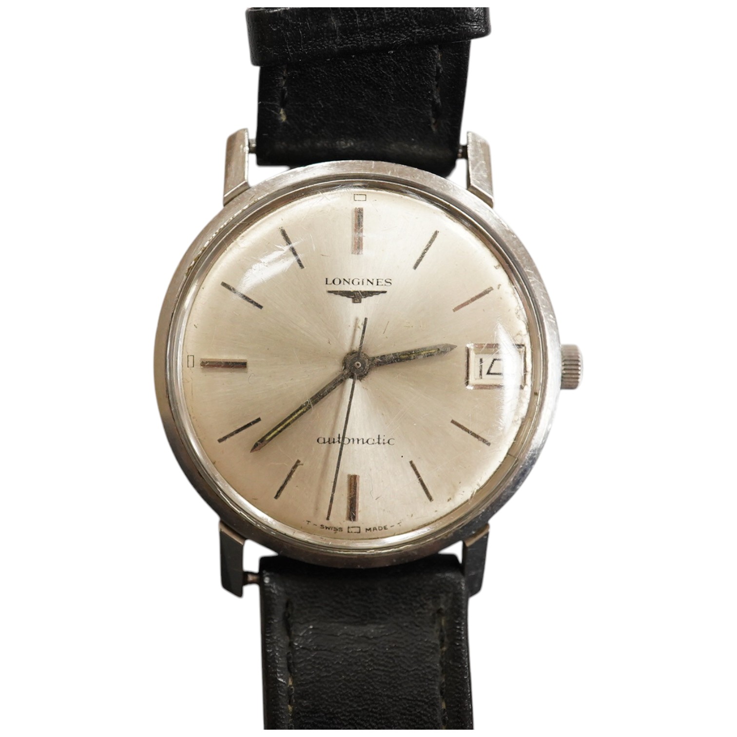 A gentleman's stainless steel Longines automatic wrist watch, with baton numerals and date aperture, case diameter 35mm, on an associated leather strap. Condition - poor